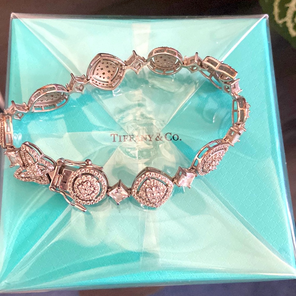 Sterling silver bracelet with hearts and butterflies.